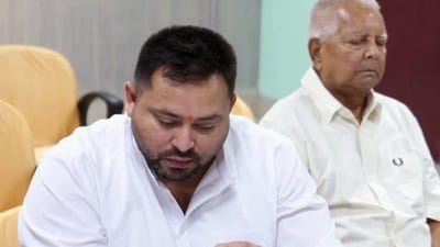 Leader of Opposition in Bihar Assembly and RJD leader Tejashwi Yadav filling his nomination paper from Raghopur constituency for the upcoming Bihar assembly elections 2025 with RJD Chief Lalu Prasad in Hajipur, Bihar, India, Wednesday,15, 2025