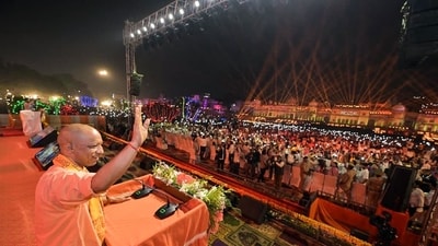 Uttar Pradesh Chief Minister Yogi Adityanath waves at the gathering in Ayodhya on the eve of Diwali. (Pawan Kumar/ANI)