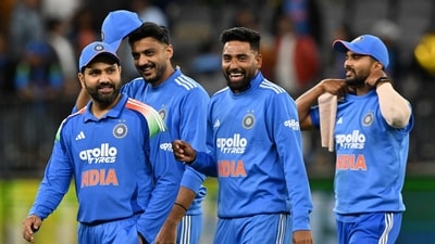 Rohit Sharma (L) and Mohammad Siraj (C) leave the field following their defeat during the first ODI match between Australia and India in Perth (AFP) Rohit Sharma (L) and Mohammad Siraj (C) leave the field following their defeat during the first ODI match between Australia and India in Perth (AFP)