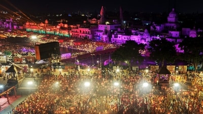 Crowds flock along the Saryu river during Diwali celebrations on the eve of Diwali on Sunday. (Rajesh Kumar Singh/AP)