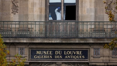 Members of a forensic team inspect a window believed to have been used in what the French Interior Ministry said was a robbery at the Louvre museum during which jewellery was stolen, in Paris, France, October 19, 2025. (REUTERS)