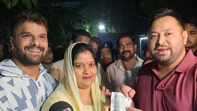 Patna: RJD leader Tejashwi Yadav, right, addresses the media after giving the party's membership slip to singer and actor Khesari Lal Yadav, right, and his wife Chanda, in Patna. (PTI) Patna: RJD leader Tejashwi Yadav, right, addresses the media after giving the party's membership slip to singer and actor Khesari Lal Yadav, right, and his wife Chanda, in Patna. (PTI)