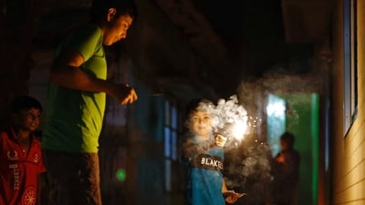 Children play with firecrackers as they celebrate Diwali (REUTERS)