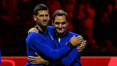 Serbia's Novak Djokovic (L) embraces Switzerland's Roger Federer (R). Serbia's Novak Djokovic (L) embraces Switzerland's Roger Federer (R).