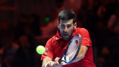 Novak Djokovic hits a return against Taylor Fritz during the third-placed match at the Six Kings Slam. (AFP) Novak Djokovic hits a return against Taylor Fritz during the third-placed match at the Six Kings Slam. (AFP)