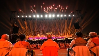 Uttar Pradesh Chief Minister Yogi Adityanath witnising a laser as part of the grand Deepotsav celebrations on the eve of Diwali in Ayodhya. (ANI)