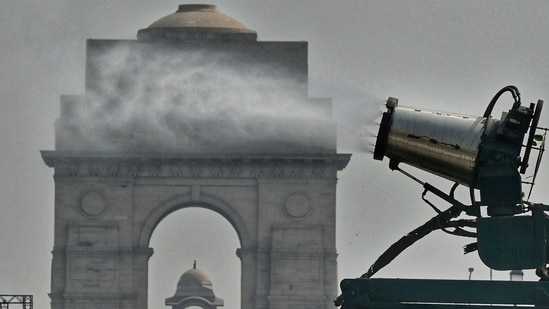 Smog Gun spray water to control pollution level as Air Quality dropped to poor category, in New Delhi on Friday.(Vipin Kumar)