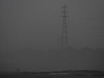 Men walk on the Yamuna riverbed amid heavy smog in New Delhi. Men walk on the Yamuna riverbed amid heavy smog in New Delhi.