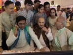 Investors, along with their families, participated in muhurat trading at the Bombay Stock Exchange in Mumbai on Tuesday, 21 October 2025.