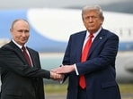 US President Donald Trump greets Russian President Vladimir Putin on the tarmac after they arrived at Joint Base Elmendorf-Richardson in Anchorage, Alaska, on August 15, 2025.