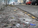 Remnants of firecrackers strewn on road. (Arvind Yadav/HT) Remnants of firecrackers strewn on road. (Arvind Yadav/HT)