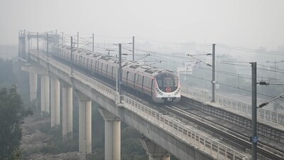 A metro approaches Punjabi Bagh station as it cuts through heavy smog on Tuesday. The Central Pollution Control Board (CPCB) reported Delhi’s overall AQI at 359 as of 10 am, with Bawana at 432, Jahangirpuri 405, and Ashok Vihar and Wazirpur both at 408, placing these areas in the ‘Severe’ category. (Sanchit Khanna/Hindustan Times) A metro approaches Punjabi Bagh station as it cuts through heavy smog on Tuesday. The Central Pollution Control Board (CPCB) reported Delhi’s overall AQI at 359 as of 10 am, with Bawana at 432, Jahangirpuri 405, and Ashok Vihar and Wazirpur both at 408, placing these areas in the ‘Severe’ category. (Sanchit Khanna/Hindustan Times)