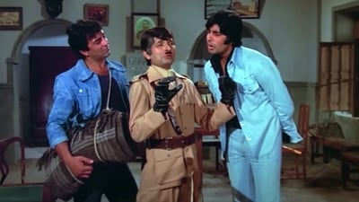 Asrani played a jailor fashioned after Charlie Chaplin and Hitler in Sholay, which starred Dharmendra and Amitabh Bachchan. Asrani played a jailor fashioned after Charlie Chaplin and Hitler in Sholay, which starred Dharmendra and Amitabh Bachchan.