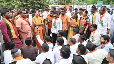 BJP workers staged a protest in front of the party office in Solapur on Tuesday. BJP workers staged a protest in front of the party office in Solapur on Tuesday.