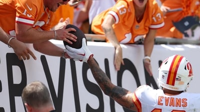 Tampa Bay Buccaneers wide receiver Mike Evans (13) gives his touchdown ball to a fan during a game against the New York Jets. (IMAGN IMAGES via Reuters Connect)