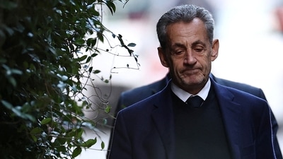 Former French President Nicolas Sarkozy leaves his house on the day of his incarceration at the Sante prison to begin his five-year prison sentence for criminal conspiracy over attempts to raise campaign funds from Libya, in Paris, France. (REUTERS)