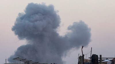 Smoke rises following an Israeli airstrike in Khan Younis, southern Gaza Strip. (REUTERS)