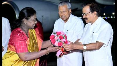 President Droupadi Murmu being received by Union Minister of State George Kurian and Kerala Chief Minister Pinarayi Vijayan upon her arrival in Thiruvananthapuram. (PTI PHOTO)
