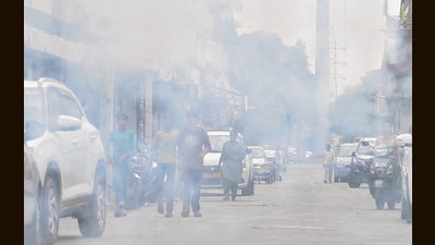 The smoke from crackers, mixed with vehicular and industrial emissions, led to a visible layer of smog across the city on Tuesday morning. (Manish/HT)