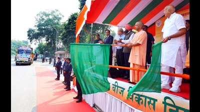 Uttar Pradesh Chief Minister Yogi Adityanath flag-off vehicles to provide seed assistance to flood-affected farmers of Punjab, in Lucknow on Tuesday. (ANI)