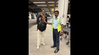 The pic shows the techie standing with the staff member who facilitated the retrieval. (X/@dexter_2397) The pic shows the techie standing with the staff member who facilitated the retrieval. (X/@dexter_2397)