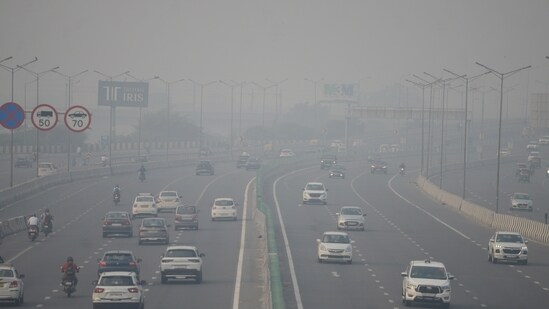 Vehicles wade through a thick smog blanket on Tuesday morning in New Delhi.(ANI)