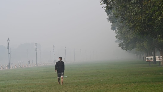 A man out on his morning stroll in Delhi as thick smog engulfs the city.(Photo by Arvind Yadav, HT)