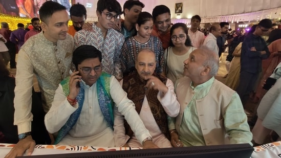 Investors, along with their families, participated in muhurat trading at the Bombay Stock Exchange in Mumbai on Tuesday, 21 October 2025. Investors, along with their families, participated in muhurat trading at the Bombay Stock Exchange in Mumbai on Tuesday, 21 October 2025.