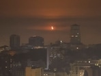 An explosion of a drone is seen in the sky over the city during a Russian missile and drone strike, amid Russia's attack on Ukraine on October 22, 2025. 
