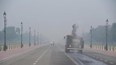 A smog gun sprays water to control pollution on Kartavaya Path in New Delhi on Wednesday as the air quality worsened. (ANI Photo)