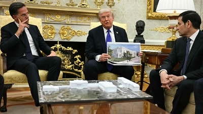 Donald Trump shows a rendition of the East Wing of the White House currently being demolished to build a ballroom (AFP) Donald Trump shows a rendition of the East Wing of the White House currently being demolished to build a ballroom (AFP)