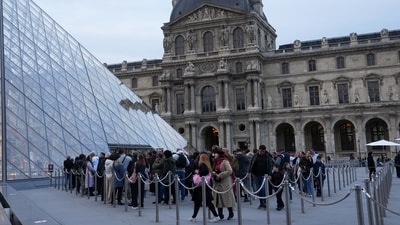 Visitors queue to enter the Louvre museum three days after historic jewels were stolen in a daring daylight heist (AP) Visitors queue to enter the Louvre museum three days after historic jewels were stolen in a daring daylight heist (AP)