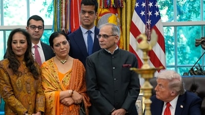 Indian ambassador to the US stands next to Trump at the Oval Office during Diwali celebrations (AP) Indian ambassador to the US stands next to Trump at the Oval Office during Diwali celebrations (AP)