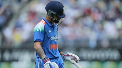 India's Virat Kohli walks off after being dismissed by Australia's Mitchell Starc in Perth. (AP)
