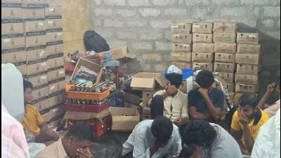 Workers at an illegal liquor manufacturing factory in a district of Andhra Pradesh earlier this week. (HT PHOTO) Workers at an illegal liquor manufacturing factory in a district of Andhra Pradesh earlier this week. (HT PHOTO)