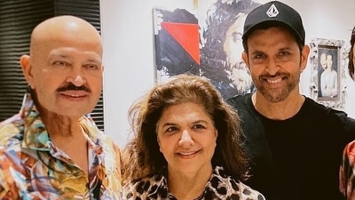 Rakesh Roshan, Pinkie Roshan and Hrithik Roshan smile for a picture at their residence.