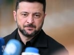 Ukraine's President Volodymyr Zelensky talks to the press as he arrives for a European Council meeting gathering the 27 EU leaders to discuss Ukraine.