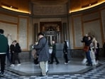 Visitors walk past the closed Apollo Gallery where eight pieces of jewels were stolen, at the Louvre Museum, in Paris, France, 