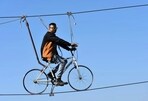 Sky cycling in India offers a breathtaking pedal-amongst-the-clouds experience, where adventure meets stunning aerial views.(unsplash)