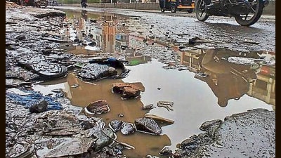 (Representative image) Videos showed cars parked amid potholes as trucks sped past on the Gurugram–Palwal route. Commuters called it a “death trap”; repairs to start soon. (HT Archive) (Representative image) Videos showed cars parked amid potholes as trucks sped past on the Gurugram–Palwal route. Commuters called it a “death trap”; repairs to start soon. (HT Archive)