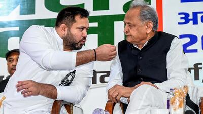 Bihar leader of opposition Tejashwi Yadav (left) with senior Congress leader Ashok Gehlot in Patna on Thursday. (ANI) Bihar leader of opposition Tejashwi Yadav (left) with senior Congress leader Ashok Gehlot in Patna on Thursday. (ANI)
