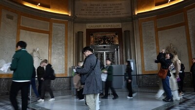 Visitors walk past the closed Apollo Gallery where eight pieces of jewels were stolen, at the Louvre Museum, in Paris, France, (REUTERS)
