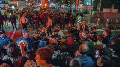 Protesters face off with police during a protest against immigration crackdown in the aftermath of a raid on Tuesday, Oct. 21, 2025, in New York. (AP)