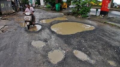 Thane, India - July -13, 2025: road at Nagala bander service road ,The condition of the roads on Thane Ghodbunder Road is looking very bad. The roads are in bad condition in places and there are potholes on the roads. Service road also bad conditions ,in Thane,in Mumbai, India, on, Sunday, July -13, 2025. ( Praful Gangurde / HT Photo ) (praful Gangurde)