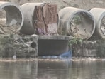An HT ground visit on Friday found that while the grills have been installed this year, irregular cleaning and lack of sustained maintenance along the riverbanks are allowing waste to pile up and slowly seep back into the water. (HT Photo)
