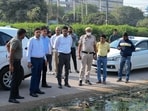 Municipal Commissioner Pradeep Dahiya inspects the sanitation system secondary garbage collection point at SPR road near DHBVN sub station, in Gurugram on Thursday. (Parveen Kumar/HT photo)