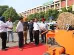 Officials from Punjab, Haryana and Uttar Pradesh exchanging ideas with farmers at PAU on Friday. (HT Photo)