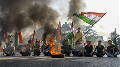 A tyre set on fire during a statewide bandh in Agartala on Thursday. (PTI) A tyre set on fire during a statewide bandh in Agartala on Thursday. (PTI)