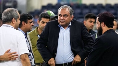 Mohsin Naqvi stands with officials on the field after India won the Asia Cup cricket final against Pakistan. (AP) Mohsin Naqvi stands with officials on the field after India won the Asia Cup cricket final against Pakistan. (AP)