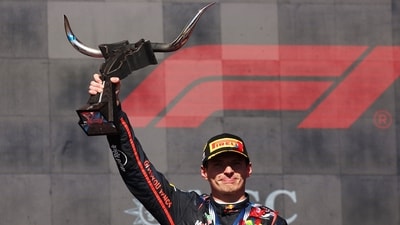 Race winner Max Verstappen of the Netherlands and Oracle Red Bull Racing lifts the winners trophy on the podium during the F1 Grand Prix of United States at Circuit of The Americas on October 19 (AFP FILE)